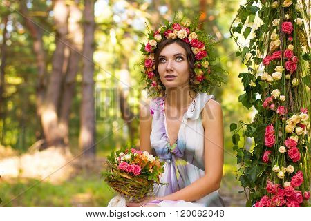 Tender woman in wreath of rose flowers.