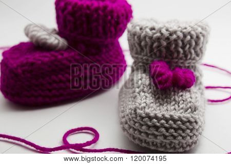 Couple Knitted Bootees To Newborn