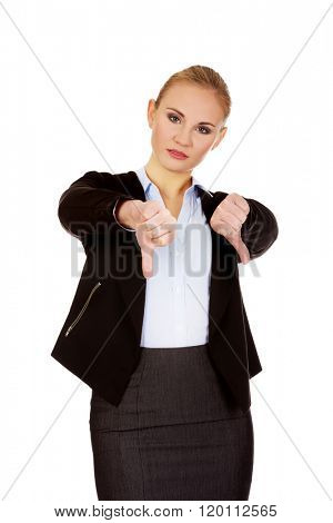 Unhappy businesswoman with thumbs down gesture