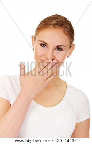 Giggles young woman covering her mouth with hand