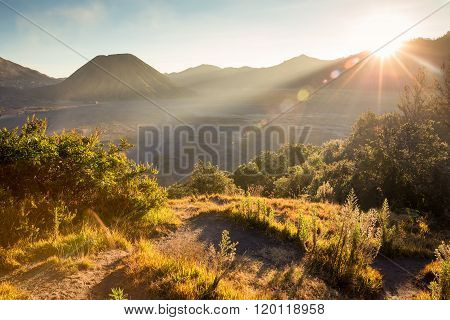 Before Sunset With Sun-flare At Mount Bromo Volcano, The Magnificent View Of Mt. Bromo Located In Br