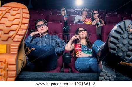 People in the cinema wearing 3d glasses