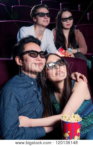 People in the cinema wearing 3d glasses