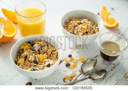 Breakfast - muesli and fruits on white background
