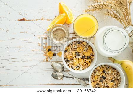 Breakfast - muesli and fruits on white background