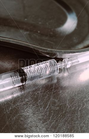Syringe With A Medicine In A Steel Tray