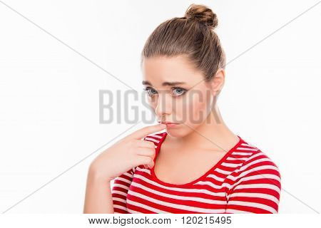 Portrait Of Upset Cute Dumpish Girl Touching Her Lips