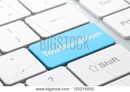Politics concept: Totalitarianism on computer keyboard background