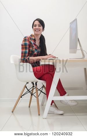 startup business, woman  working on dektop  computer at creative modern office relaxing and have fun