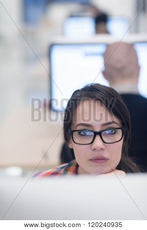 startup business, woman  working on dektop  computer at creative modern office relaxing and have fun