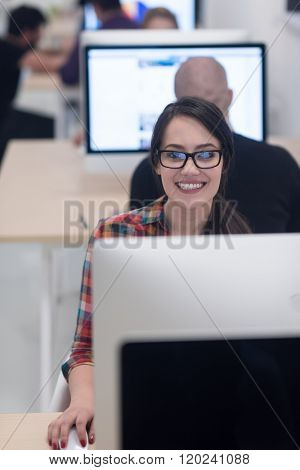 startup business, woman  working on dektop  computer at creative modern office relaxing and have fun