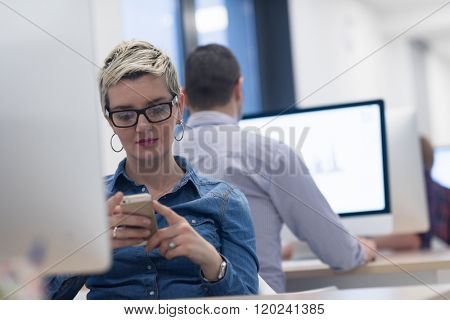 startup business, woman  working on dektop  computer at creative modern office relaxing and have fun