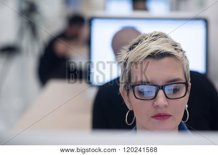 startup business, woman  working on dektop  computer at creative modern office relaxing and have fun