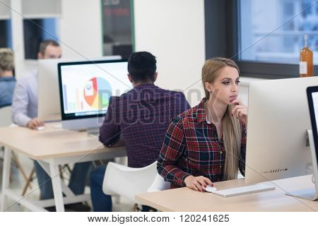 startup business, woman  working on dektop  computer at creative modern office relaxing and have fun
