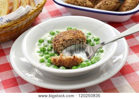 green peas fozelek (thich vegetable stew) and fasirt (fried meatball), hungarian cuisine