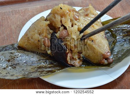 sticky rice steamed with pork and salt egg in banana leaf of Chinese Duanwu festival