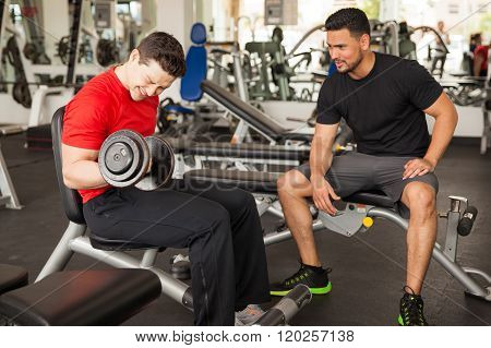 Man Encouraging His Friend At The Gym