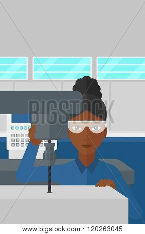 Woman working with boring mill.