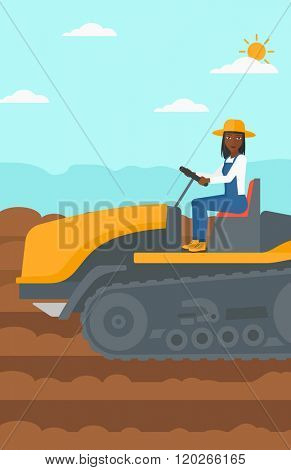 Farmer driving catepillar tractor.
