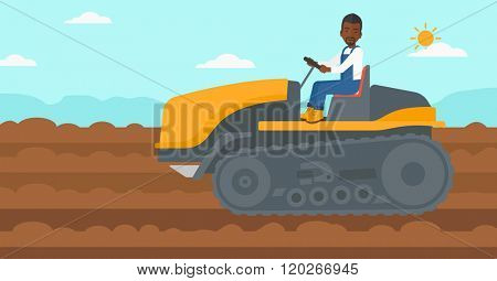 Farmer driving catepillar tractor.