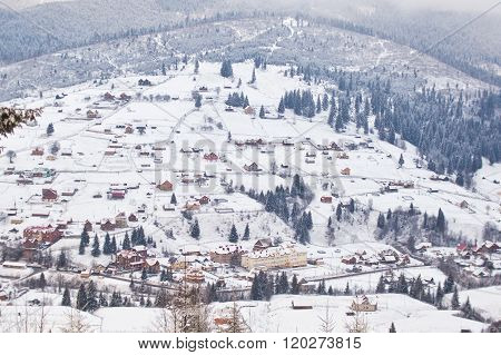 Mountain  village on the slopes of the Carpathian Mountains in winter. Ukraine