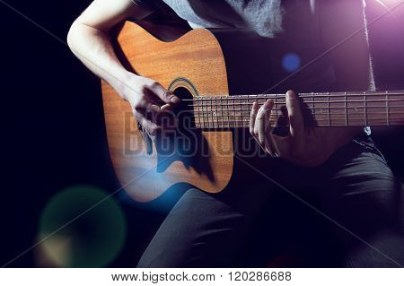 Musician Playing On Acoustic Guitar