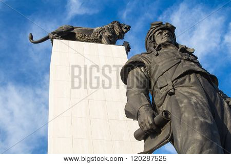 Statue Of M.r.stefanik And A Lion