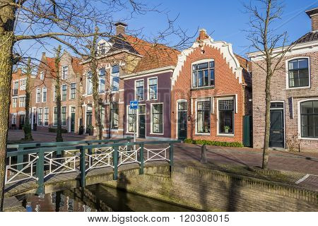 Colorful Houses And A Bridge At A Canal In Franeker