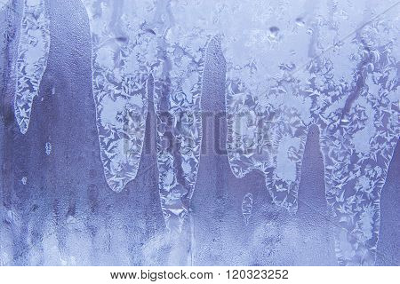 Blue frostwork on a window glass