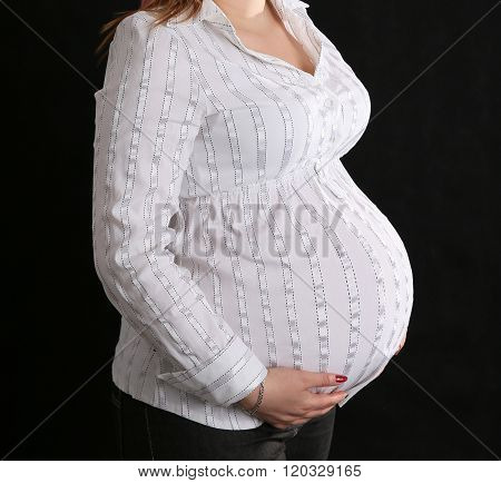 A young pregnant woman.