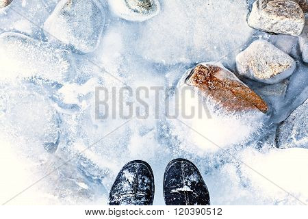 transparent ice with air bubbles and stones