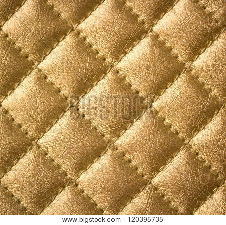 Golden Genuine Leather Upholstery Texture or Background