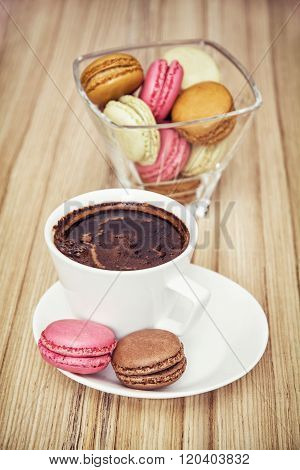 Cup Of Black Coffee With French Colorful Macarons