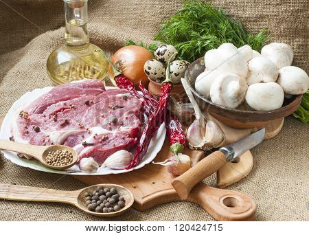 Fresh Meat With Mushrooms Spices And Herbs.