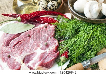 Fresh Meat With Mushrooms Spices And Herbs.