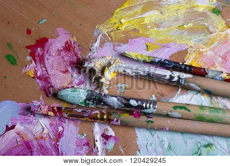 Paint And Brushes On Wooden Palette
