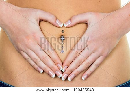 woman has hands on belly