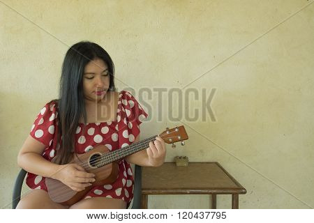 Woman Play Ukulele
