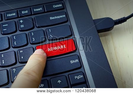 Close Up Of Finger On Keyboard Button With Adware Word