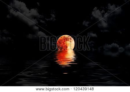 Dark red full moon in cloud with water reflection closeup showing the details of the lunar