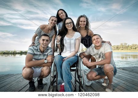 Happines group of Friedns on the wooden pier.