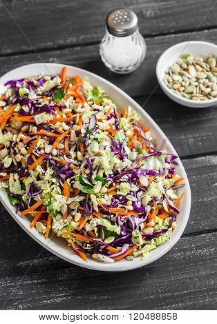 Cole Slaw With Seeds And Pine Nuts - Delicious Healthy Vegetarian Food. On A Dark Rustic Wooden Back