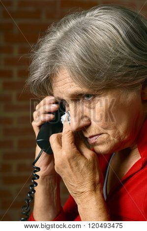 Mature woman calling doctor