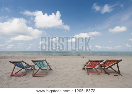 Beach chairs on perfect tropical white sand beach