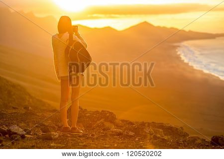 Woman photographing Fuerteventura island