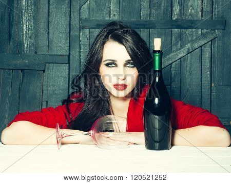 Thoughtful Woman With Bottle