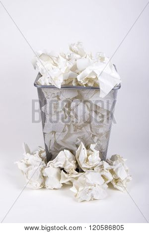 A Waste Paper Bin With Screwed Up Paper