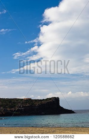 Cliffs at the end of sandy beach in San Pietro island, Sardinia