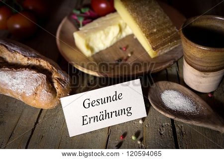 Cheese, Bread, Salt And Vegetables On A Wooden Table, Card With Gesunde Ernährung