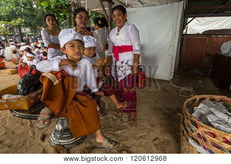 SANUR, BALI - MAR 18, 2016: Unidentified local people during ceremony Melasti Ritual. Melasti is a Hindu Balinese purification ceremony and one of the most important rituals of Bali island. 